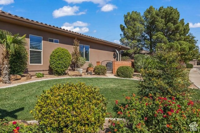 1618 N 775 W, Washington, UT 84780 - view of front of home featuring stucco siding and a front lawn