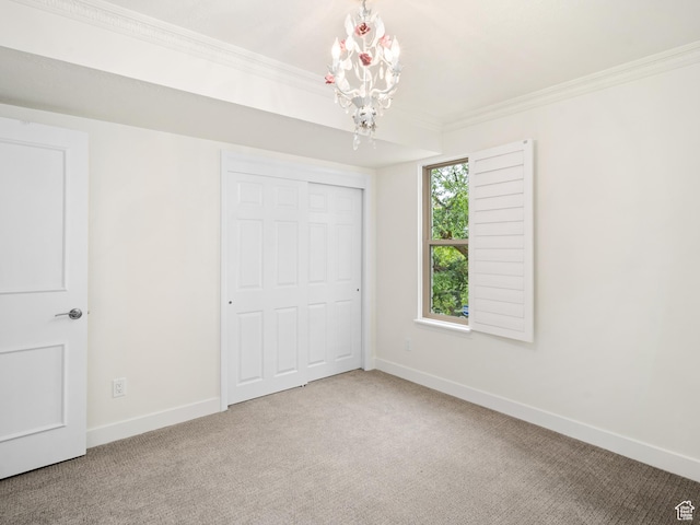 4253 S Spring Rd E, Ogden, UT 84403 - unfurnished bedroom with a chandelier, ornamental molding, baseboards, carpet floors, and a closet