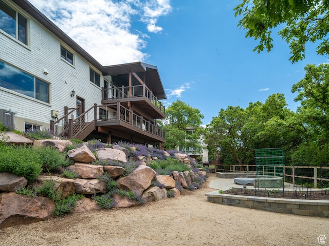 4253 S Spring Rd E, Ogden, UT 84403 - rear view of property with a vegetable garden
