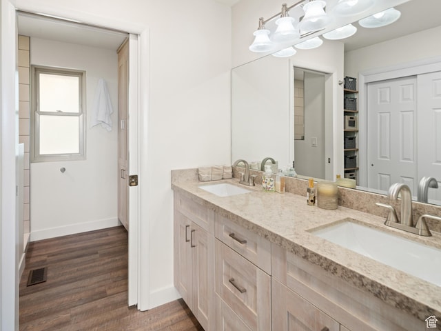 4253 S Spring Rd E, Ogden, UT 84403 - full bath featuring double vanity, baseboards, and wood finished floors