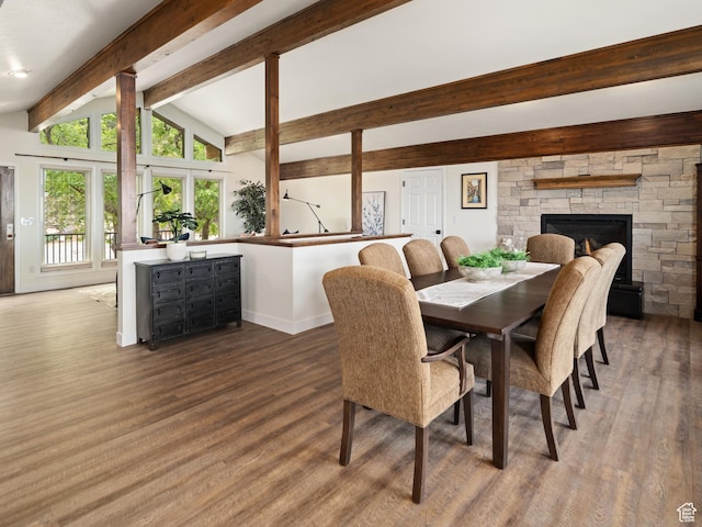 4253 S Spring Rd E, Ogden, UT 84403 - dining area featuring wood finished floors, baseboards, and a stone fireplace