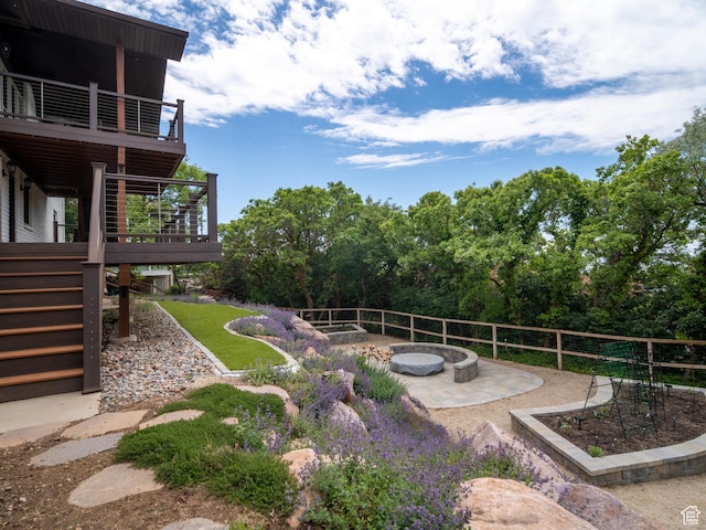 4253 S Spring Rd E, Ogden, UT 84403 - view of yard featuring stairs, a patio area, a deck, a fire pit, and a balcony