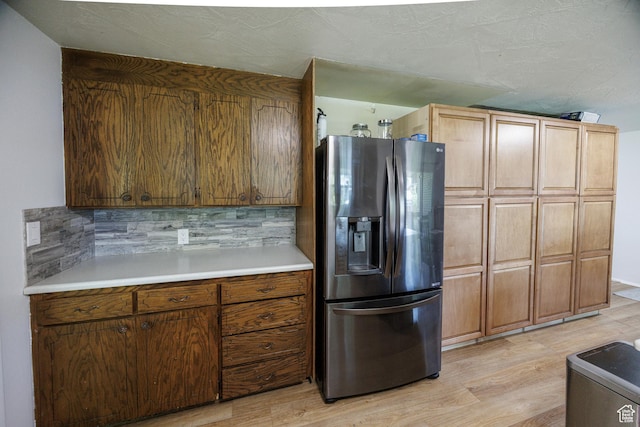 1070 E 120 S, Orem, UT 84097 - kitchen featuring stainless steel fridge, light wood-style floors, light countertops, and backsplash