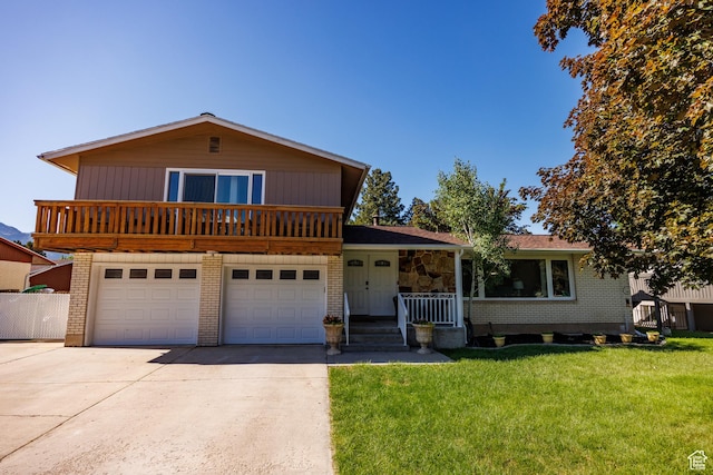 1070 E 120 S, Orem, UT 84097 - split level home with driveway, a front yard, an attached garage, a porch, and brick siding