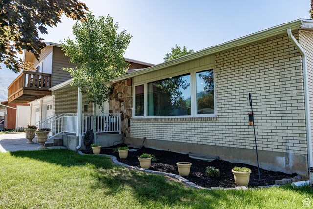 1070 E 120 S, Orem, UT 84097 - view of front of property with brick siding, a front lawn, and covered porch