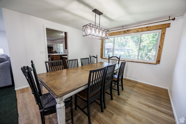 1070 E 120 S, Orem, UT 84097 - dining room with light wood-style flooring, baseboards, and a chandelier