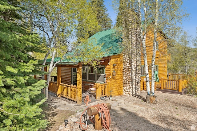 5399 E Targhee Dr E, Oakley, UT 84055 - rustic home featuring faux log siding