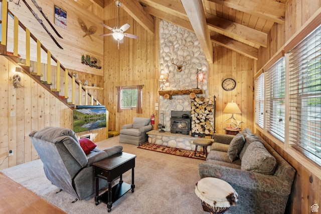 5399 E Targhee Dr E, Oakley, UT 84055 - living room with wood ceiling with exposed beams, wood walls, a wood stove, high vaulted ceiling, and stairs