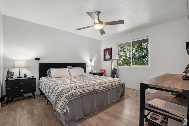 5586 W 10130 N, Highland, UT 84003 - bedroom featuring light wood-type flooring, baseboards, and a ceiling fan