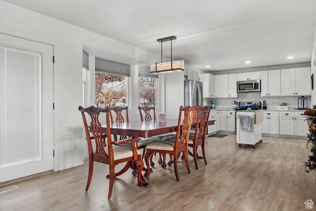 5586 W 10130 N, Highland, UT 84003 - dining space featuring light wood-type flooring, recessed lighting, and baseboards