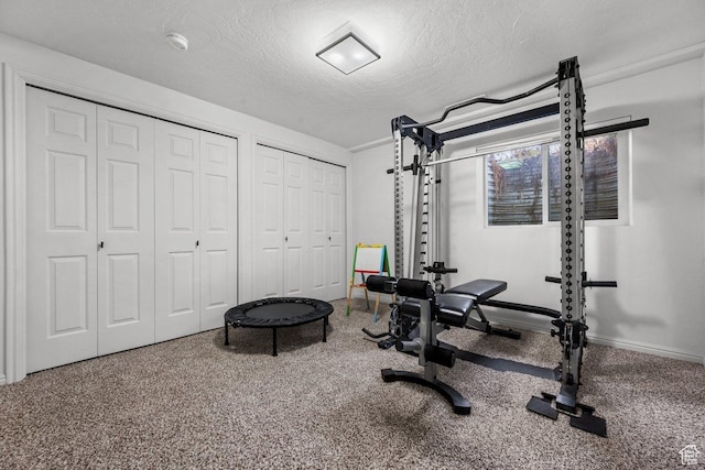 5586 W 10130 N, Highland, UT 84003 - workout room featuring a textured ceiling and baseboards