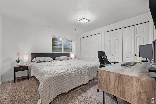 5586 W 10130 N, Highland, UT 84003 - carpeted bedroom with multiple closets, a desk, a textured ceiling, and baseboards