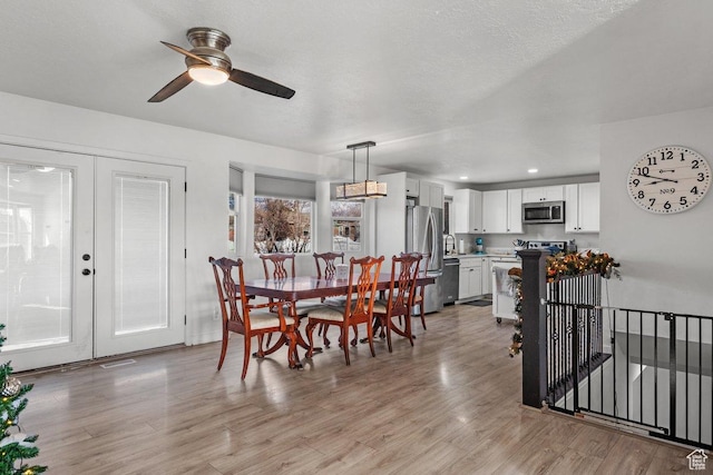 5586 W 10130 N, Highland, UT 84003 - dining room featuring light wood-style flooring, ceiling fan, french doors, and recessed lighting