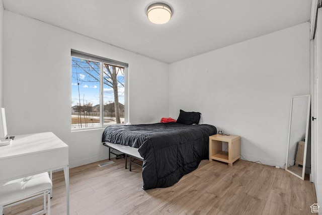 5586 W 10130 N, Highland, UT 84003 - bedroom featuring light wood finished floors and baseboards