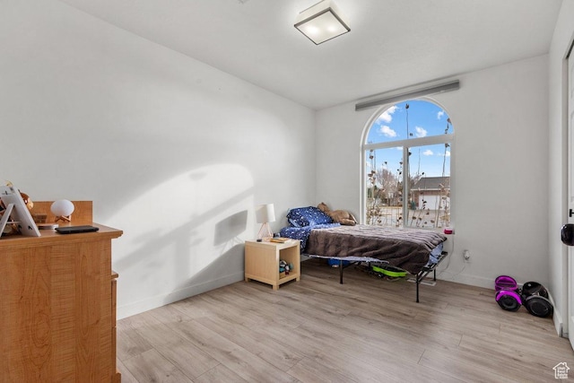 5586 W 10130 N, Highland, UT 84003 - bedroom featuring wood finished floors and baseboards