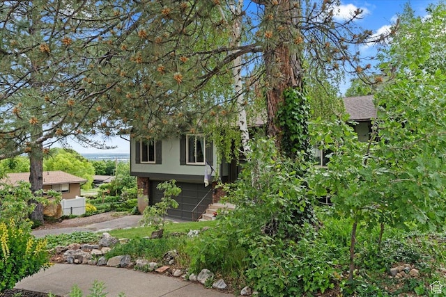 3275 N 250 E, North Ogden, UT 84414 - view of home's exterior with driveway and a garage