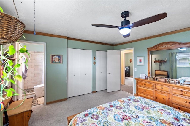3275 N 250 E, North Ogden, UT 84414 - carpeted bedroom with connected bathroom, two closets, a textured ceiling, and ceiling fan