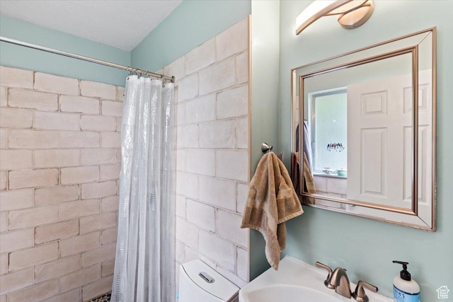 3275 N 250 E, North Ogden, UT 84414 - bathroom with toilet, tiled shower, and a sink
