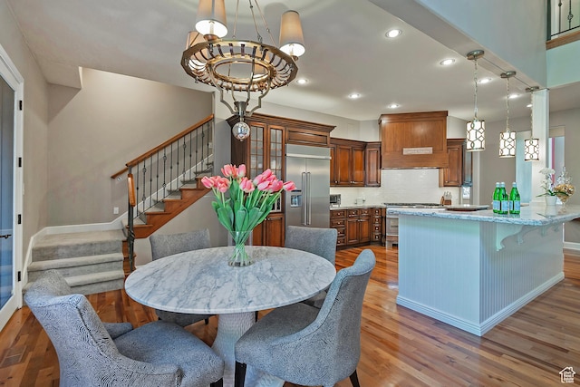963 E Old English Rd, Draper, UT 84020 - dining room featuring wood finished floors, stairway, a chandelier, recessed lighting, and baseboards