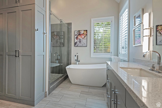 963 E Old English Rd, Draper, UT 84020 - full bath featuring a shower stall, vanity, and a soaking tub
