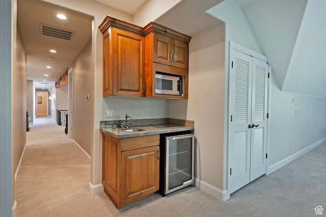 963 E Old English Rd, Draper, UT 84020 - bar area with beverage cooler, light carpet, white microwave, a sink, and baseboards