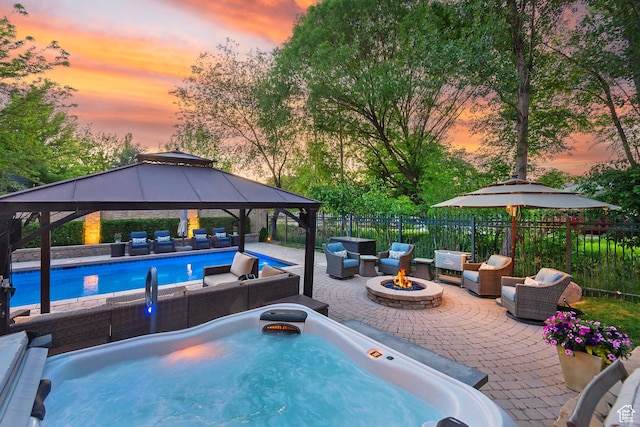 963 E Old English Rd, Draper, UT 84020 - view of swimming pool with an outdoor living space with a fire pit, a gazebo, a patio area, and a hot tub