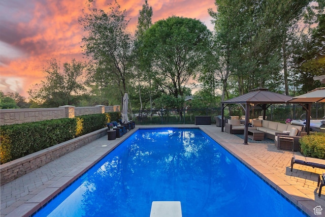 963 E Old English Rd, Draper, UT 84020 - pool at dusk featuring an outdoor living space, a gazebo, a fenced backyard, a patio, and view of scattered trees