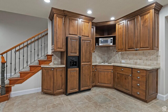 963 E Old English Rd, Draper, UT 84020 - kitchen with a sink, baseboards, built in appliances, decorative backsplash, and recessed lighting