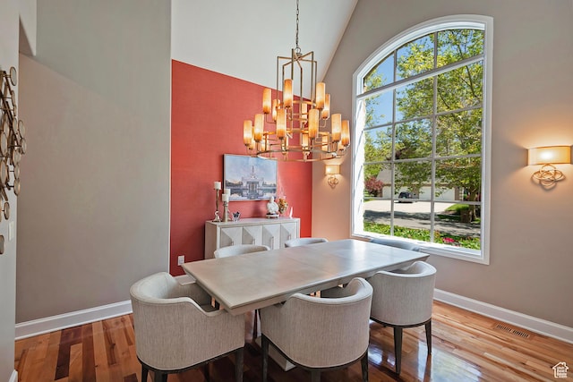 963 E Old English Rd, Draper, UT 84020 - dining room featuring a chandelier, wood finished floors, baseboards, and vaulted ceiling