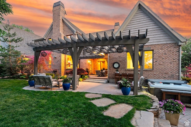 963 E Old English Rd, Draper, UT 84020 - back of house at dusk featuring brick siding, a pergola, a chimney, a patio area, and a lawn