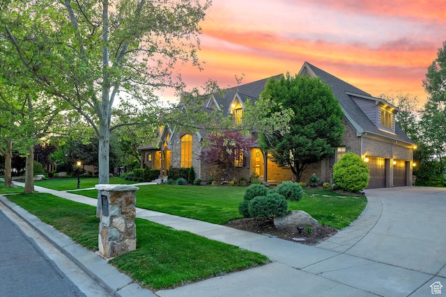 963 E Old English Rd, Draper, UT 84020 - view of front facade with an attached garage, a front lawn, driveway, and brick siding