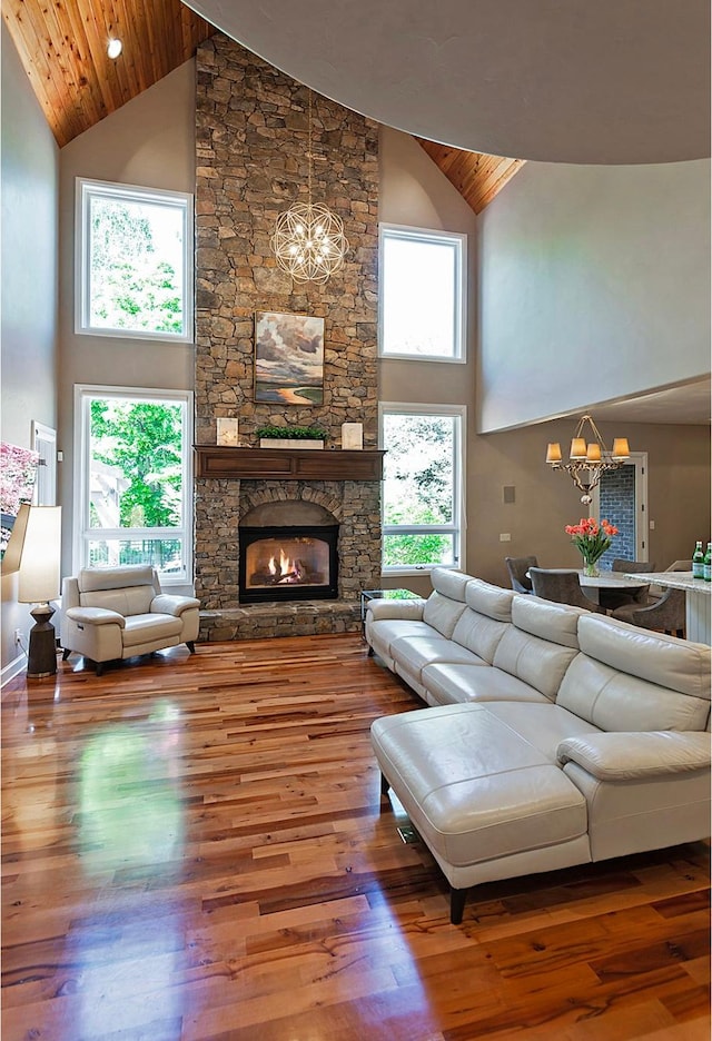 963 E Old English Rd, Draper, UT 84020 - living area with high vaulted ceiling, a chandelier, wood finished floors, wooden ceiling, and a fireplace