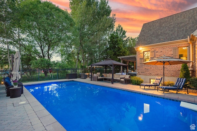 963 E Old English Rd, Draper, UT 84020 - pool at dusk with an outdoor hangout area, a gazebo, and a patio area