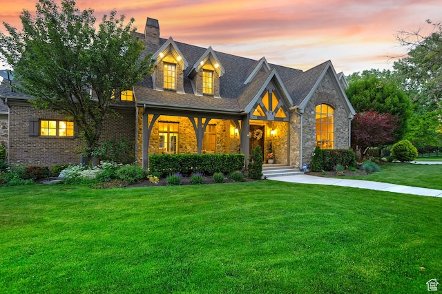 963 E Old English Rd, Draper, UT 84020 - view of front of house featuring a lawn, a chimney, stone siding, and brick siding