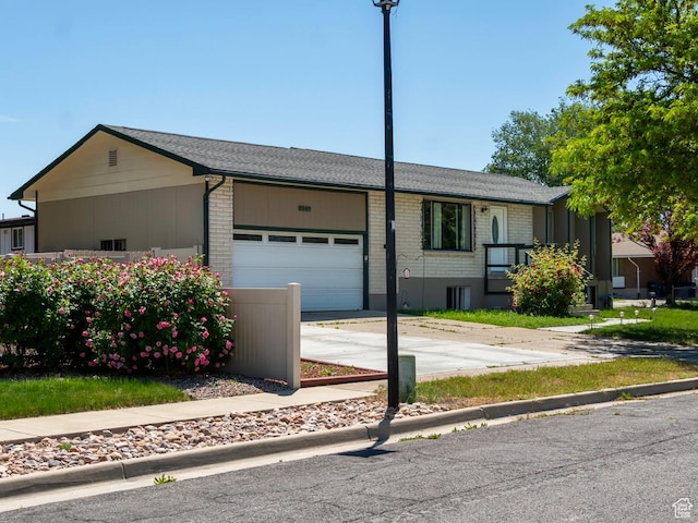 2567 W 2975 S, West Valley City, UT 84119 - single story home featuring an attached garage, driveway, and brick siding