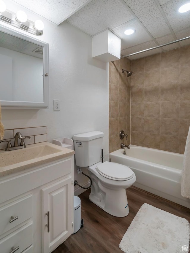 2567 W 2975 S, West Valley City, UT 84119 - bathroom with toilet, wood finished floors, bathing tub / shower combination, vanity, and recessed lighting