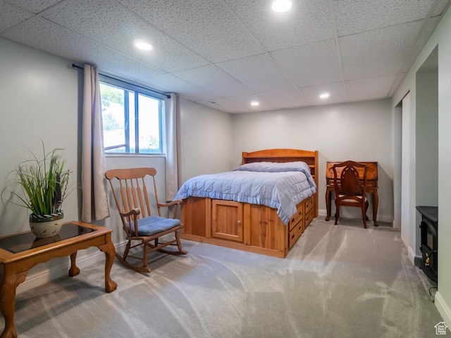 2567 W 2975 S, West Valley City, UT 84119 - bedroom with light colored carpet, a drop ceiling, a wood stove, recessed lighting, and baseboards