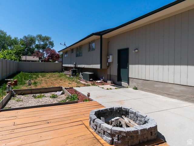 2567 W 2975 S, West Valley City, UT 84119 - wooden terrace with a fenced backyard and an outdoor fire pit