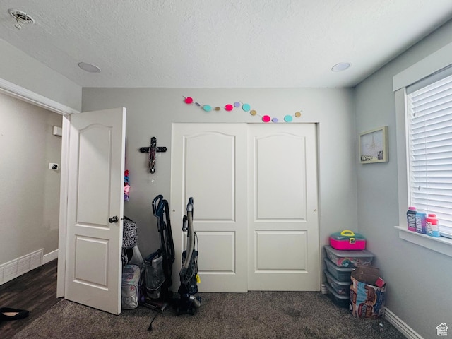 2552 W 2025 N, Clinton, UT 84015 - bedroom with carpet floors, a textured ceiling, and baseboards