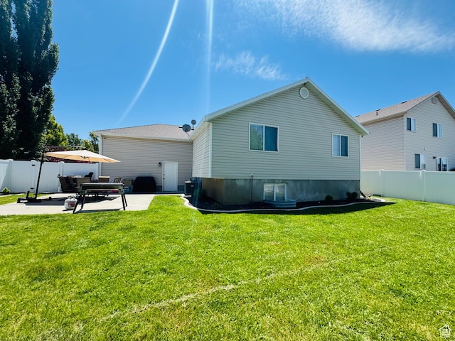 2552 W 2025 N, Clinton, UT 84015 - rear view of property with a patio area