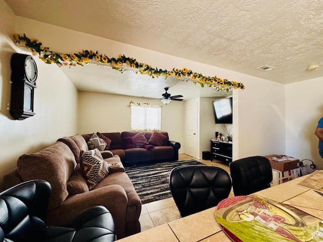 2552 W 2025 N, Clinton, UT 84015 - living room with a textured ceiling, light tile patterned flooring, and ceiling fan