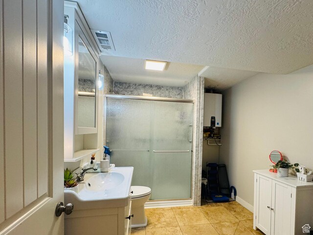2552 W 2025 N, Clinton, UT 84015 - full bathroom with vanity, a stall shower, toilet, a textured ceiling, and tile patterned floors