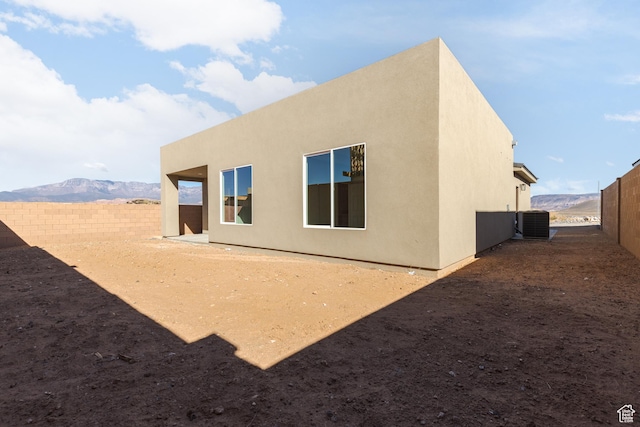 2175 W 320 S, Hurricane, UT 84737 - back of property with a fenced backyard, central AC, and stucco siding