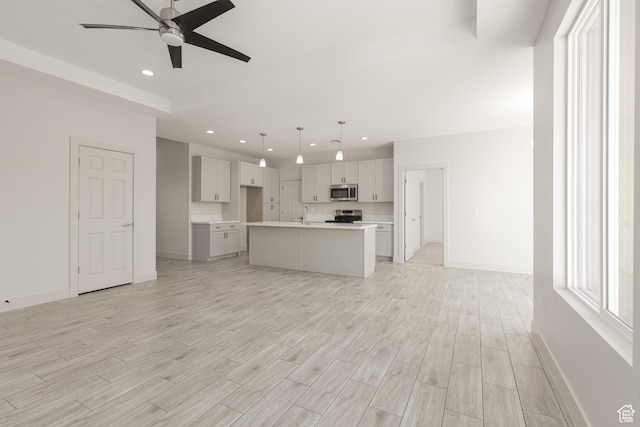 2175 W 320 S, Hurricane, UT 84737 - unfurnished living room with recessed lighting, ceiling fan, baseboards, and light wood-style flooring