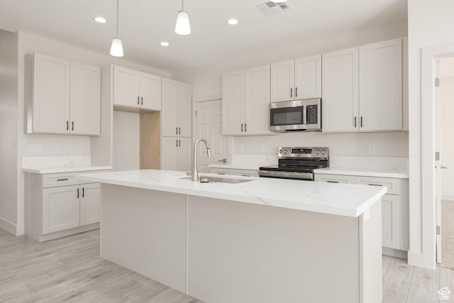 2175 W 320 S, Hurricane, UT 84737 - kitchen featuring stainless steel appliances, a sink, recessed lighting, pendant lighting, and light stone counters