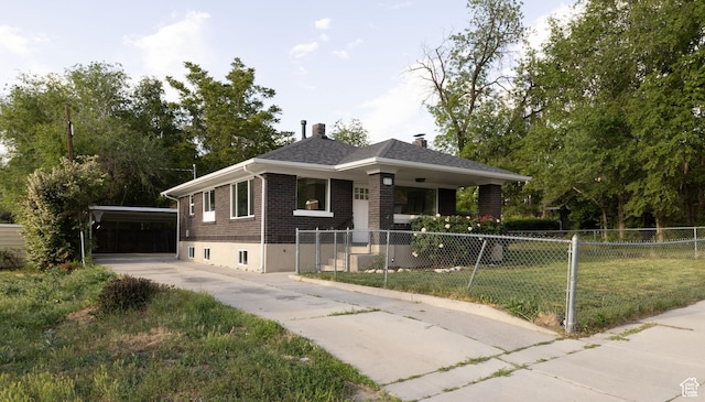 21 E 8680 S, Sandy, UT 84070 - view of front facade with brick siding, concrete driveway, and a chimney