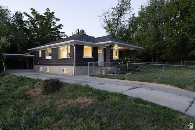 21 E 8680 S, Sandy, UT 84070 - view of front of property featuring brick siding, a chimney, a carport, and driveway