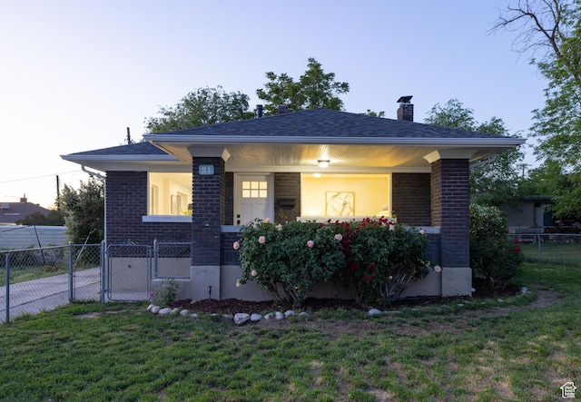 21 E 8680 S, Sandy, UT 84070 - view of front facade with brick siding, a chimney, a gate, and a porch