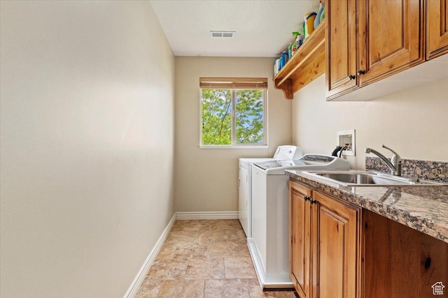14248 Tumbleweed Way, Draper, UT 84020 - washroom featuring independent washer and dryer, cabinet space, baseboards, and stone finish flooring