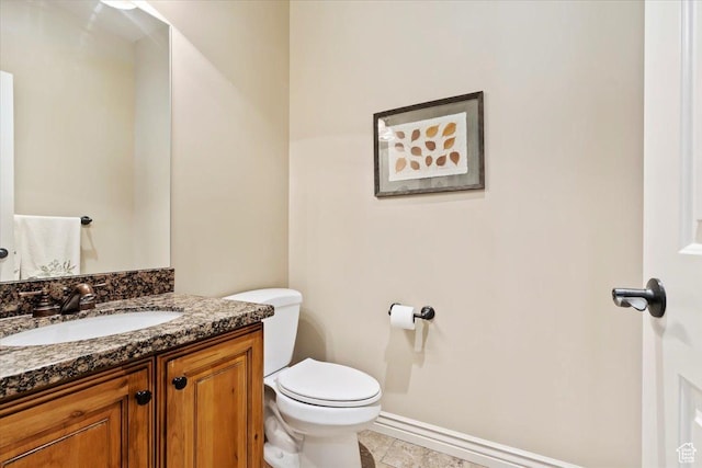 14248 Tumbleweed Way, Draper, UT 84020 - bathroom with toilet, vanity, and baseboards